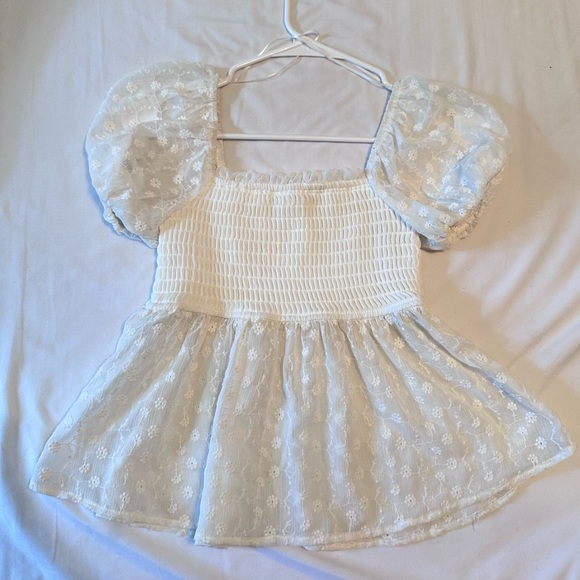 Francesca's Collections Tops - Cute flirty top, has flower detail on the mesh.
